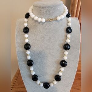 Black and White Beaded Necklace With Gold-tone Spacers.